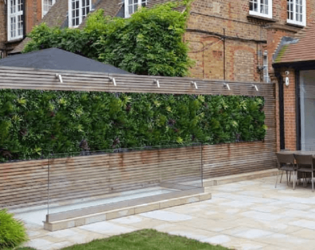 A Vistafolia artificial green wall installation on a garden fence