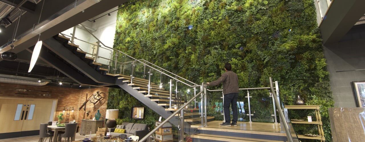Artificial living wall by restaurant staircase