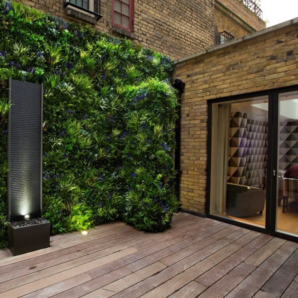 outdoor green walls on a decking area with vertical garden