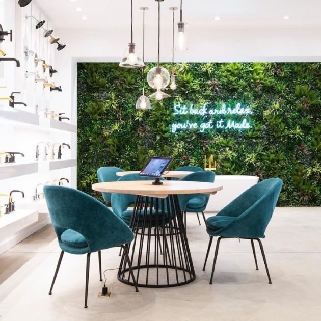 cafe area with green living wall and neon sign