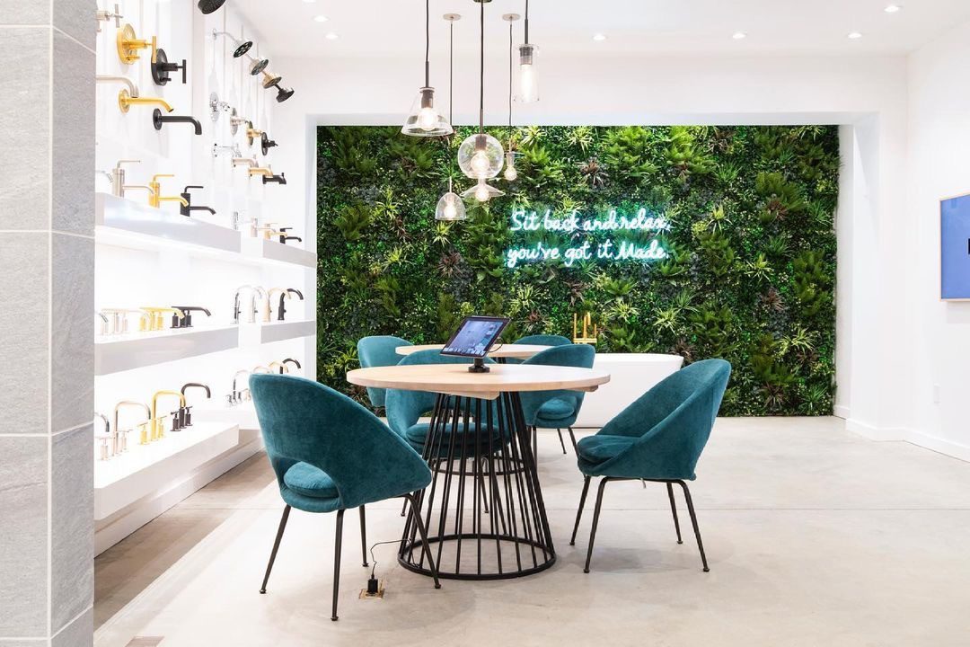 cafe area with green living wall and neon sign