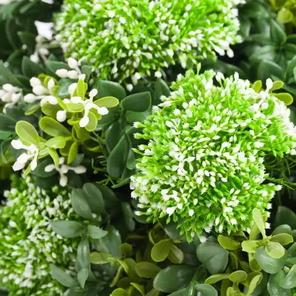 A close up of an artificial white allium plant