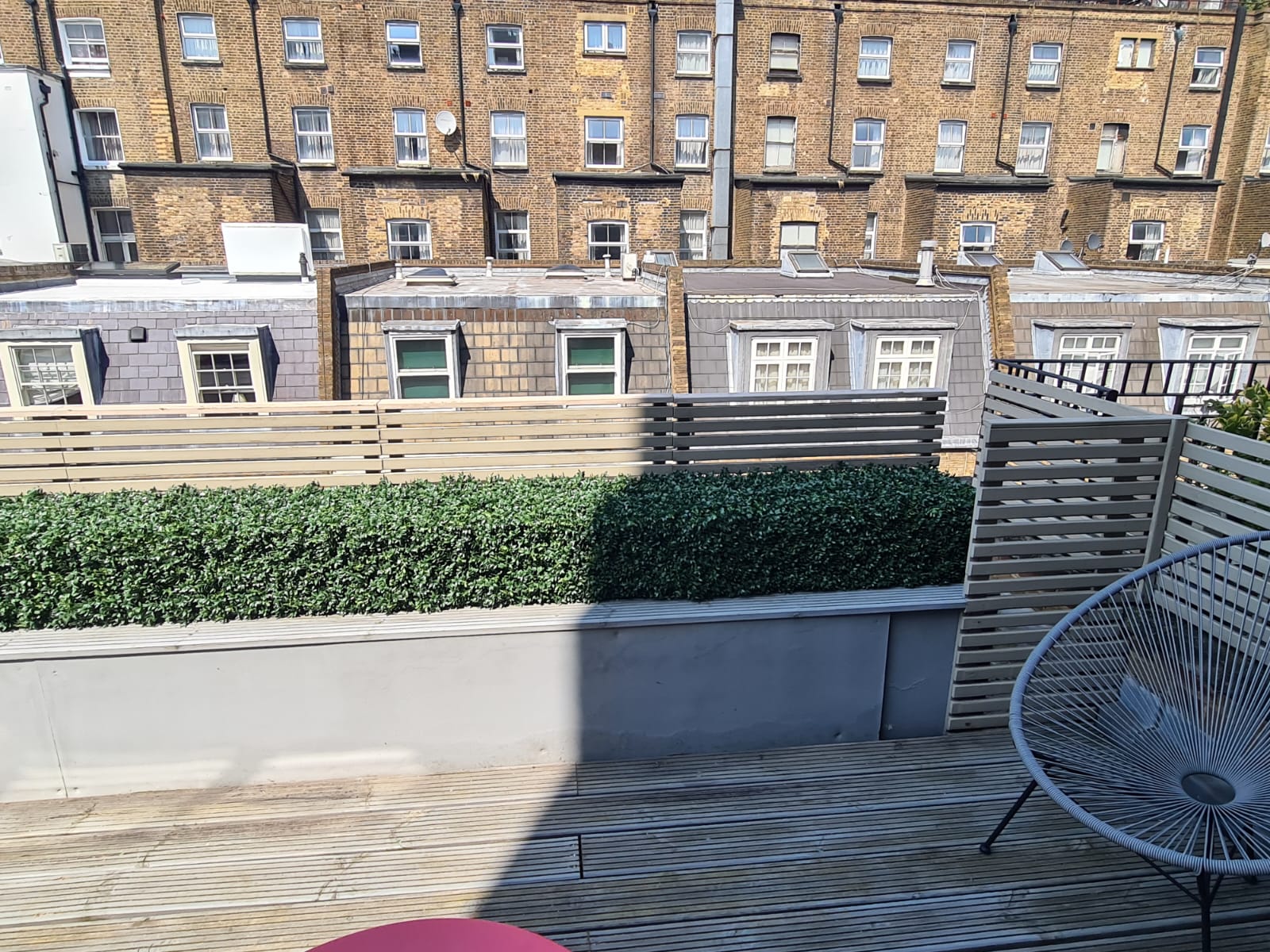 An artificial boxwood hedge in a London Garden